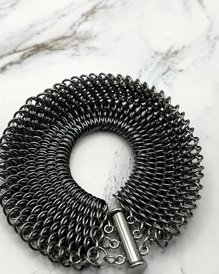 Dense black dragonscale mesh cuff